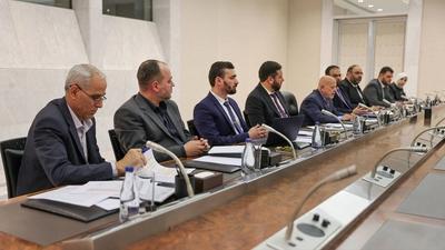Syrian President Ahmad al-Shara meets with Minister of Economy and Industry Mohammad Nidal al-Shaar-stock-photo