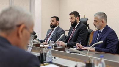Syrian President Ahmad al-Shara meets with Minister of Economy and Industry Mohammad Nidal al-Shaar-stock-photo