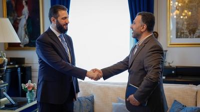 Syrian President Ahmed al-Sharaa meets with Farid Al-Methhane, a former military police officer in Damascus, During his visit to France-stock-photo
