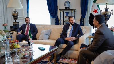 Syrian President Ahmed al-Sharaa meets with Farid Al-Methhane, a former military police officer in Damascus, During his visit to France-stock-photo