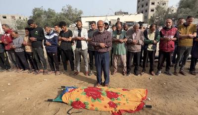Relatives mourn by the body of Palestinian eleven-year-old girl Rimas Obeid, who was killed in Israeli strikes-stock-photo
