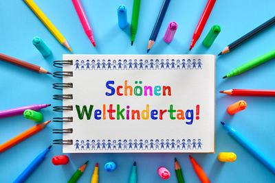 August 13, 2024: Have a great World Children s Day! Greeting for World Children s Day on a notepad surrounded by colorfu-stock-photo
