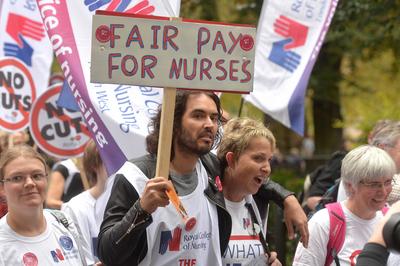 Image Licensed to Parsons Media. 18/10/2014. London, United Kingdom Pictured is comedian Russell Brand marching with the-stock-foto