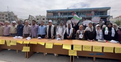 Palestinians attend an event marking the 77th anniversary of the Nakba at Al-Jaouni School, which houses displaced persons-stock-foto
