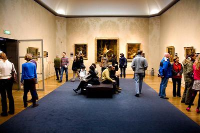 Room with paintings and visitors, three still lifes hang at the back with dead animals; Exhibition Damien Hirst - For Th-stock-photo