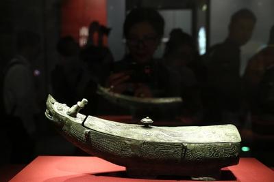 BEIJING, CHINA - MAY 18: Visitors view an exhibit at the exhibition The Exhibition Series on the Origins of Chinese Civi-stock-photo