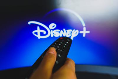 May 10, 2022, Brazil. In this photo illustration a close-up of a hand holding a TV remote control seen in front of the D-stock-foto