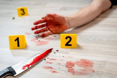 Augsburg, Bavaria, Germany - February 16, 2024: Symbolic image crime scene of a murder case (staged scene). Man smeared-stock-foto