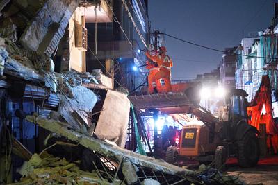 Three Storey Building Collapses In Rohini Area Of Delhi-stock-photo