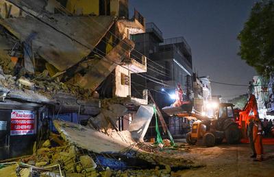 Three Storey Building Collapses In Rohini Area Of Delhi-stock-photo
