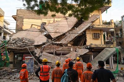 Three Storey Building Collapses In Rohini Area Of Delhi-stock-photo