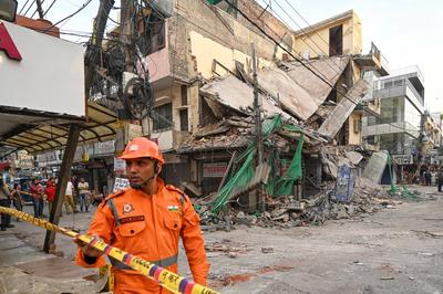 Three Storey Building Collapses In Rohini Area Of Delhi-stock-photo