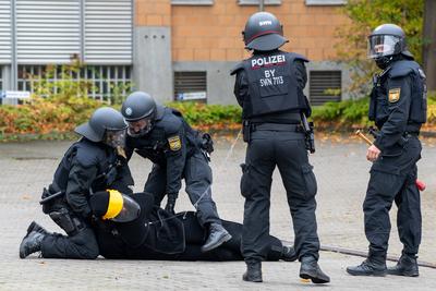 Bavaria, Germany - October 18, 2024: Veiled or masked police officers from a special unit arrest perpetrators or attacke-stock-foto