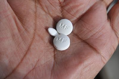 Copenahgen /Denmark/12 OIctober 2022/ Medicine tablets Metfomin actavis and AtovastatinTeva on hand palm . (Photo. Franc-stock-photo