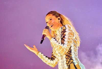 Singer and artist Helene Fischer, GER in front of a rainbow at her concert at the fairground on Aug 20, 2022 in Munich-stock-photo