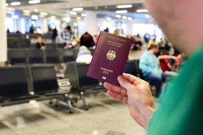 Frankfurt am Main, Hesse, Germany - December 28, 2024: A passport as a symbol of identity and mobility. In the middle of-stock-foto
