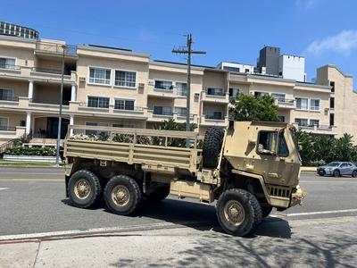 LOS ANGELES, CA - JUNE 13: U.S. Marine Corps vehicle drives towards the entrance of the parking lot of Wilshire Federal-stock-photo