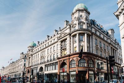 Luxury fashion stores in Regent Street in London London, UK - May 15, 2019: Street scene in Regent Street with sunlight-stock-photo