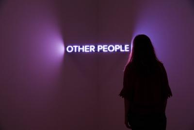 . 20/07/2018. London, United Kingdom. Jenny Holzer s Work At Tate Modern. A staff member views at LED text sculpture. J-stock-photo