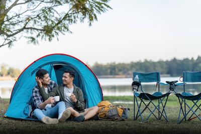 Happy Asian male gay couple on camping together in a forest. romantic vocation trip. lgbt concept Happy Asian male gay c-stock-photo