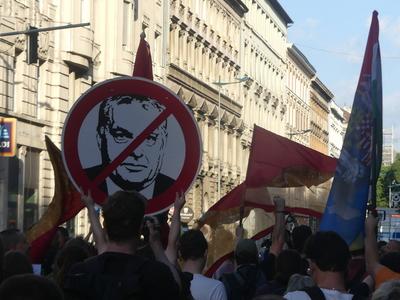Hungarians and lgbt supporters protest hungary's new anti lgbt+ law in front of parliament.-stock-photo