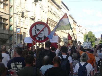 Hungarians and lgbt supporters protest hungary's new anti lgbt+ law in front of parliament.-stock-photo