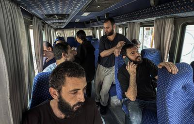 Palestinian prisoners released by the Israeli army are taken to Al-Aqsa Martyrs Hospital for medical examination, the Palestinian prisoners arrested by the Israeli army from Gaza Strip during their ground incursion, Dair El-Balah-stock-foto