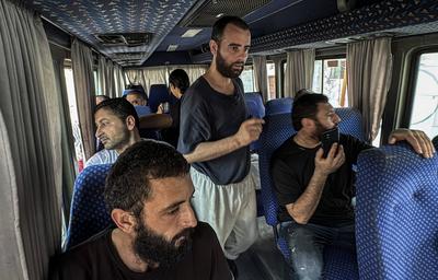 Palestinian prisoners released by the Israeli army are taken to Al-Aqsa Martyrs Hospital for medical examination, the Palestinian prisoners arrested by the Israeli army from Gaza Strip during their ground incursion, Dair El-Balah-stock-foto