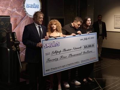 Natasha lyonne, nick offerman & john goodman illuminated the empire state building for smurfs premiere-stock-photo