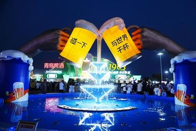 QINGDAO, CHINA - JULY 18: Visitors have fun during the 35th Qingdao International Beer Festival at the Xihai an (West Co-stock-photo
