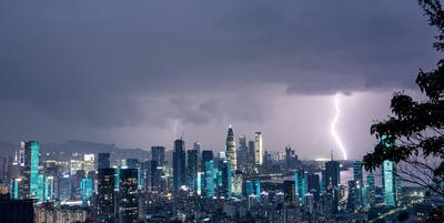 SHENZHEN, CHINA - JULY 19: A bolt of lightning strikes the sky as typhoon Wipha approaches on July 19, 2025 in Shenzhen,-stock-foto
