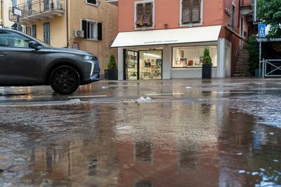 Nago-Torbole, Trentino, Italy - July 21, 2025: Storm on Lake Garda with extreme rainfall and thunderstorms. Water pushes-stock-foto