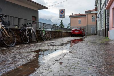 Nago-Torbole, Trentino, Italy - July 21, 2025: Storm on Lake Garda with extreme rainfall and thunderstorms. Puddles on a-stock-foto