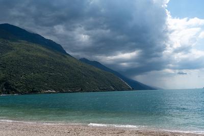 Nago-Torbole, Trentino, Italy - July 21, 2025: Storm on Lake Garda with extreme rainfall and thunderstorms. Black clouds-stock-foto
