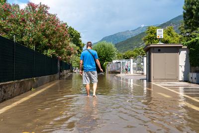 Nago-Torbole, Trentino, Italy - July 21, 2025: Storm on Lake Garda with extreme rainfall and thunderstorms. Tourist walk-stock-foto