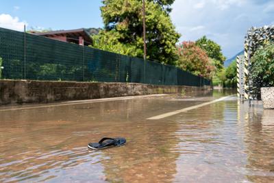 Nago-Torbole, Trentino, Italy - July 21, 2025: Storm on Lake Garda with extreme rainfall and thunderstorms. A flip-flop-stock-foto