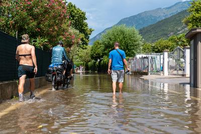 Nago-Torbole, Trentino, Italy - July 21, 2025: Storm on Lake Garda with extreme rainfall and thunderstorms. Tourist walk-stock-foto