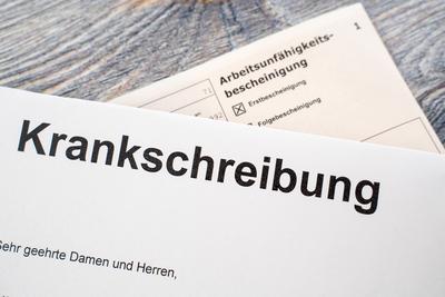 Bavaria, Germany - October 15, 2024: Sick note is written on a piece of paper, or letter, next to a certificate of incap-stock-foto