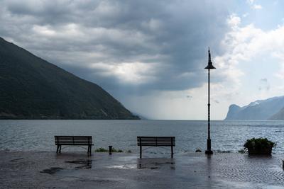 Nago-Torbole, Trentino, Italy - July 21, 2025: Storm on Lake Garda with extreme rainfall and thunderstorms. Storm clouds-stock-foto