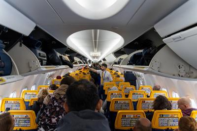 Bavaria, Germany - December 2, 2023: Aircraft interior with numerous travelers in the rows of seats shortly before depar-stock-photo