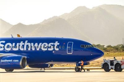 Cabo, B.C.S. Mexico. Nov 22, 2024. A Southwest Airlines Boeing 737 aircraft parked at an airport gate, ready for boarding. Ground crew members are seen preparing the plane.-stock-photo