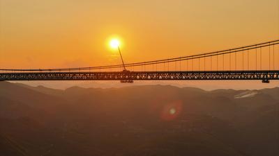 QIANXINAN, CHINA - AUGUST 02: Aerial view of a construction site of the Huajiang Grand Canyon Bridge on August 2, 2025 i-stock-foto