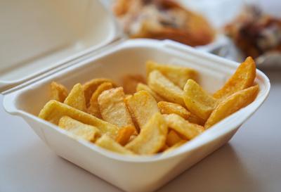 Fat nutrion in Cologne, Nov 22, 2019 French fries in a styrofoam box for take away in Cologne, Germany, November 22, 20-stock-foto