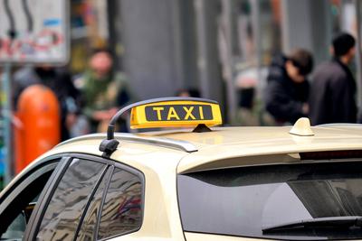 Berlin, Germany - March 27, 2025: Taxi in Berlin, classic yellow roof sign on a cab, on the road in Berlin city traffic-stock-foto