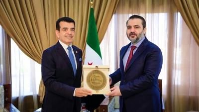 Syrian Minister of Foreign Affairs and Expatriates, Asaad al-Shaibani, meets with the Director-General of the Islamic World Educational, Scientific and Cultural Organization (ICESCO), Salim bin Mohammed al-Malik-stock-foto