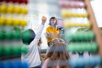 Teacher and students, Learn and study about airplanes in a classroom of school where youngsters sit and listen attentive-stock-foto
