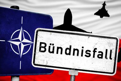 Germany - September 10, 2025: PHOTOMONTAGE, A NATO sign next to a worn street sign with the inscription, Alliance case,-stock-foto