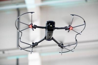 Augsburg, Bavaria, Germany - September 30, 2025: A DJI Mavic 3 drone hovers in flight with LED light on and protective f-stock-foto