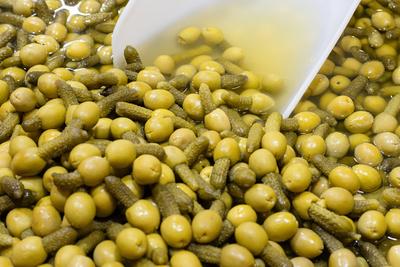 Green olives stuffed with pickle background. Spanish appetizer Green olives stuffed with pickle background. Spanish appe-stock-foto