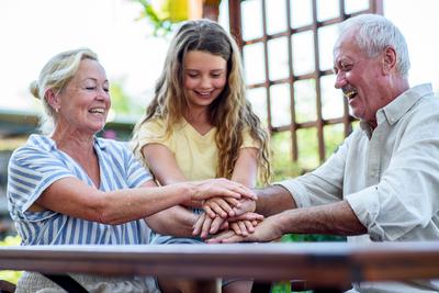 Family bonding with teamwork gesture.-stock-foto